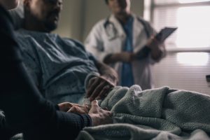 man being treated by doctor for HIV