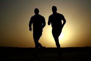 2 men running to improve their health