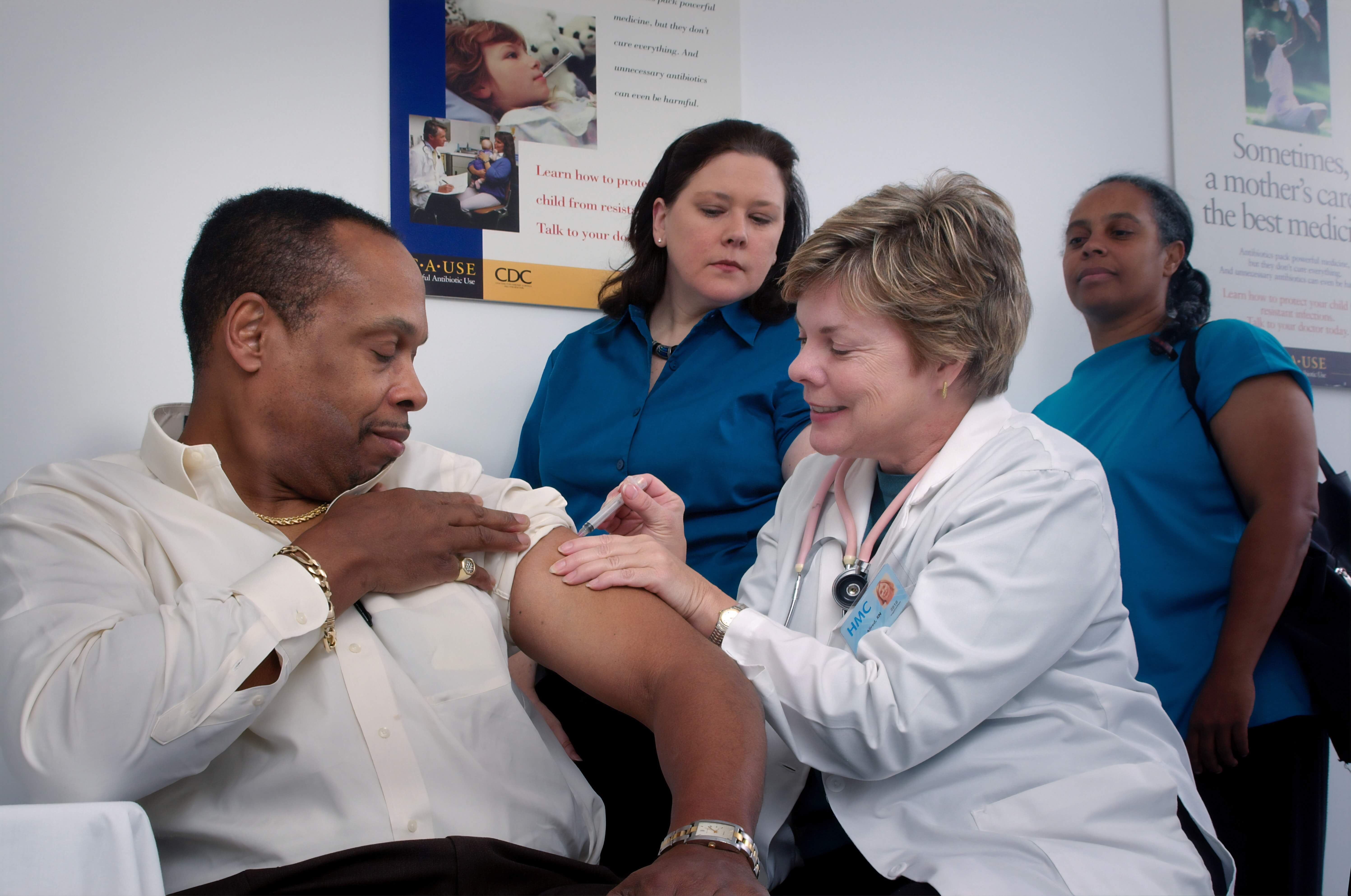 a man getting a flu shot in late march