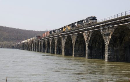 Picture of a train on a bridge in Harrisburg PA, where the Hamilton Health Center is located